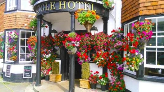 The Bugle's entrance covered in summer hanging baskets